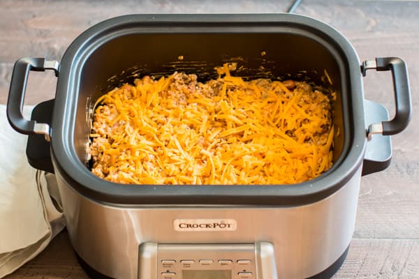 uncooked enchilada dip in a slow cooker