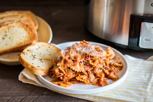 chicken bacon pasta on a white plate.