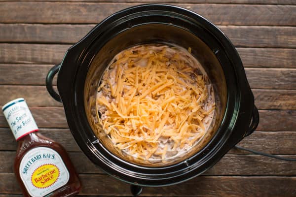 uncooked barbecue chicken dip in a slow cooker.