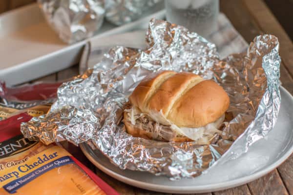 cheesy pork sandwich on foil