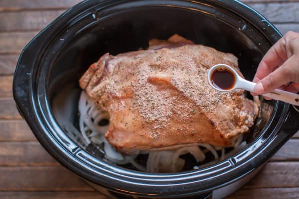brown pork roast in slow cooker. Spoon with liquid smoke over it.