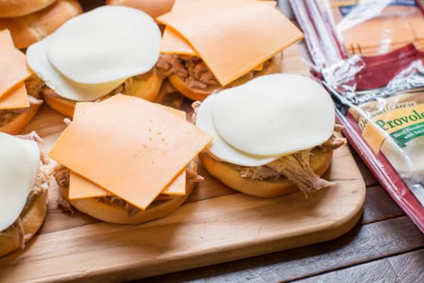 cheese slices on pork sandwiches.