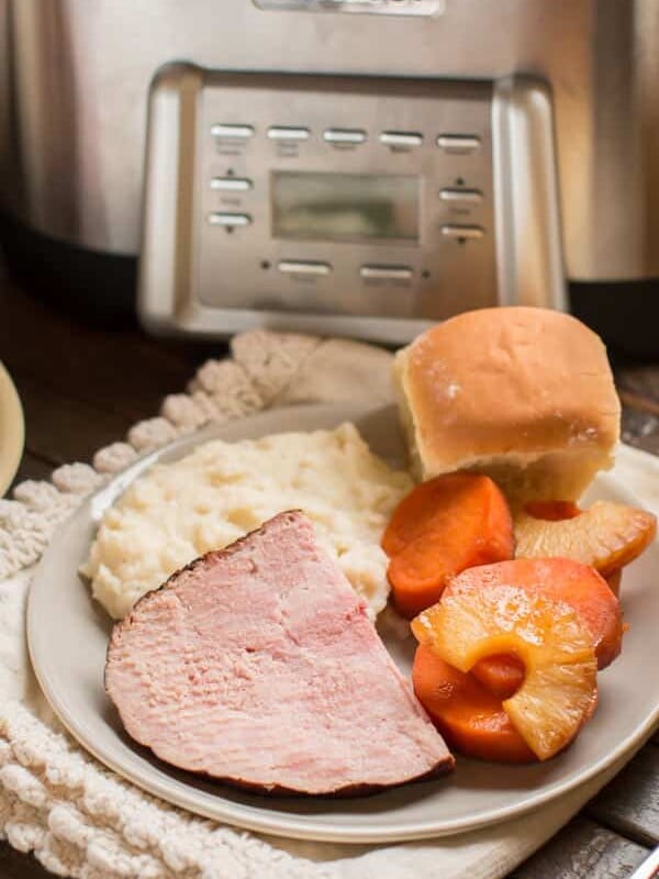 sliced ham, sweet potatoes and mashed potatoes.