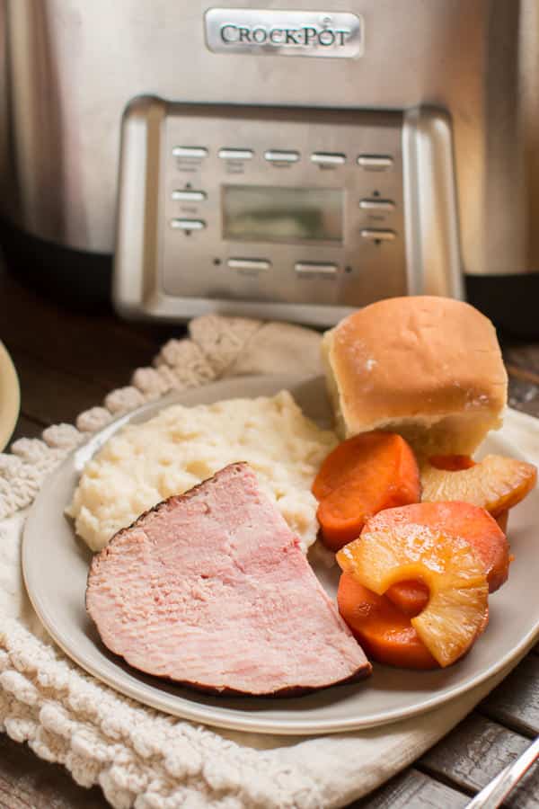 sliced ham, sweet potatoes and mashed potatoes.