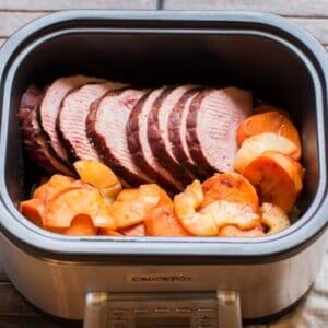 sliced ham, sweet potaotes and pineapple in a slow cooker.