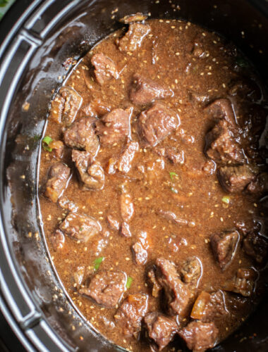 close up of beef in rich teriyaki sauce in the slow cooker.