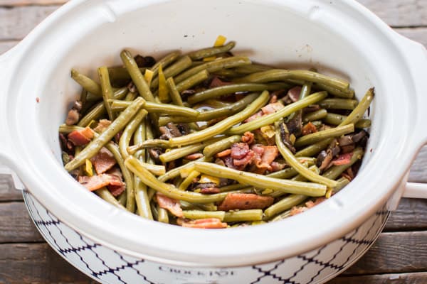 cooked holiday green beans in a slow cooker.