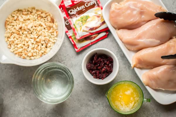 chicken breasts, chicken gravy packets, stuffing mix, cranberries, water and melted butter.