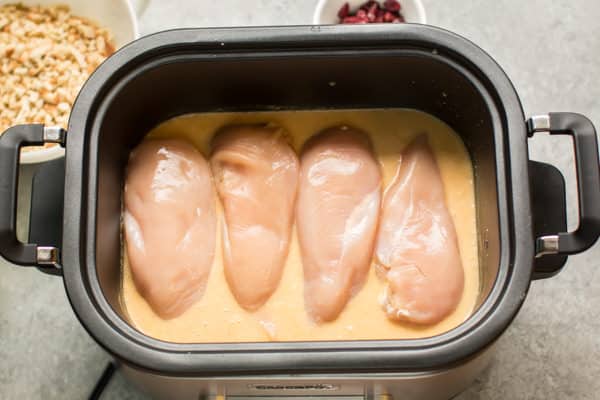 chicken breasts and gravy in a slow cooker.