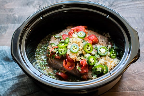 beef roast with tomatoes, jalapeno and sauce, uncooked.