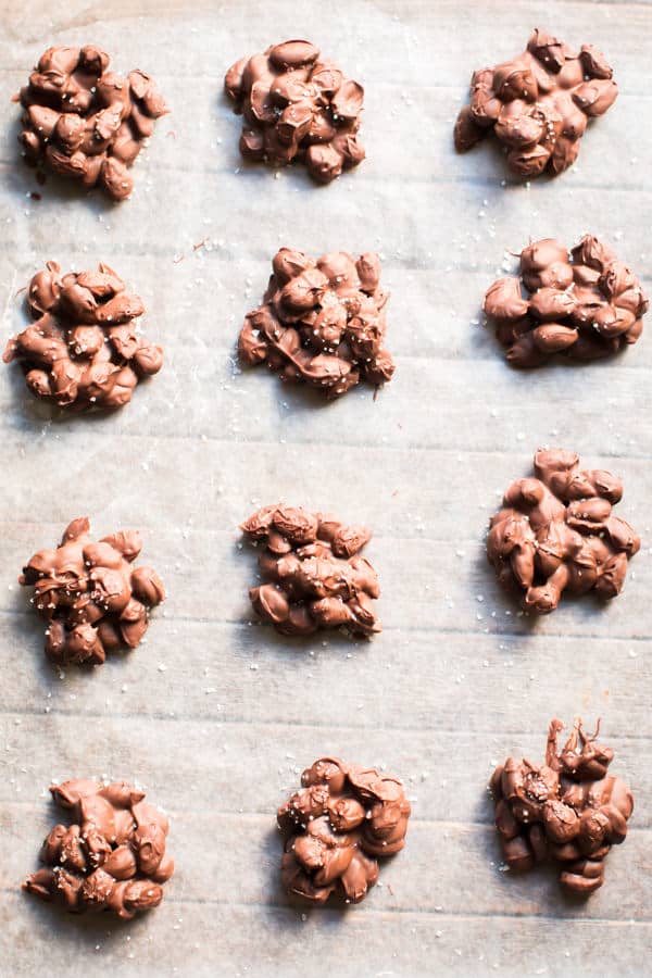 almond chocolate sea salt clusters on parchment paper.