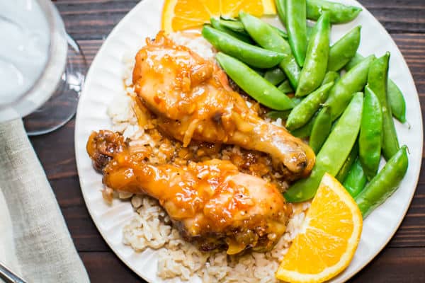 2 drumsticks on rice with sugar snap peas