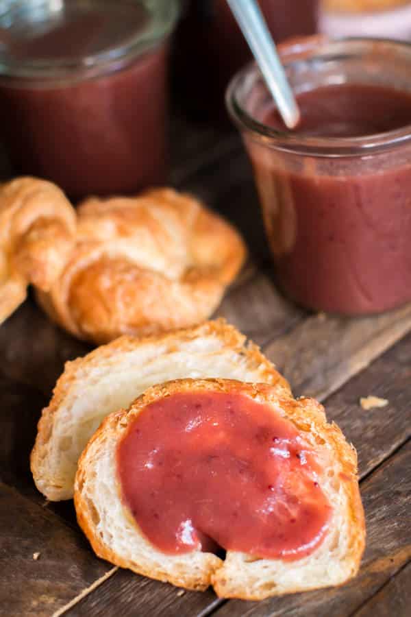 croissant with cranberry apple butter on it.