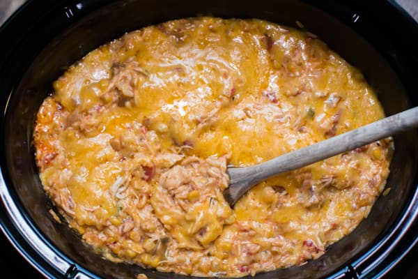 close up of fiesta chicken casserole with spoon in it.
