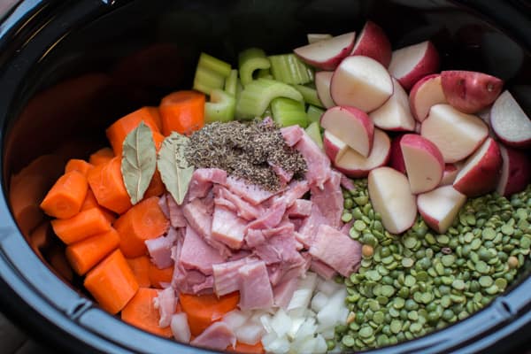 split peas, ham, red potatoes, carrots, onion, and seasoning in a slow cooker.