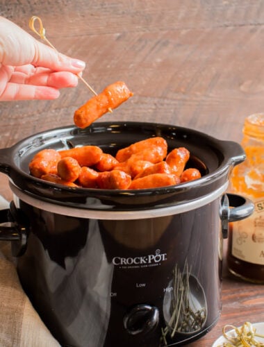 slow cooker with apple butter little smokies in it.