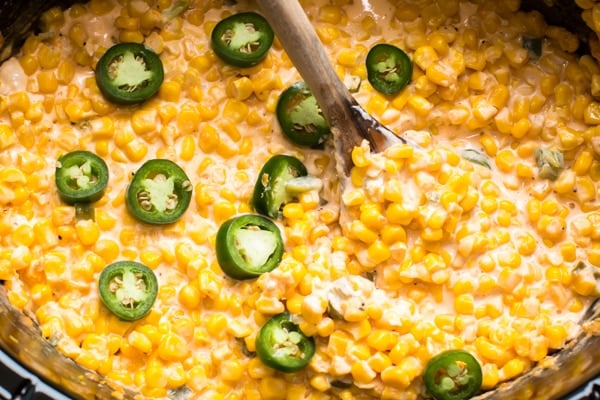 creamy jalapeno corn with a spoon in it.