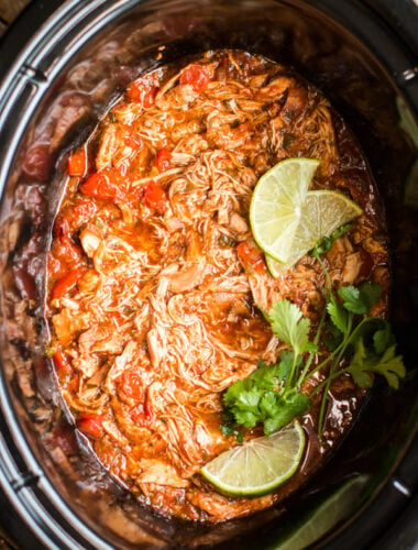 shredded salsa chicken in a slow cooker.