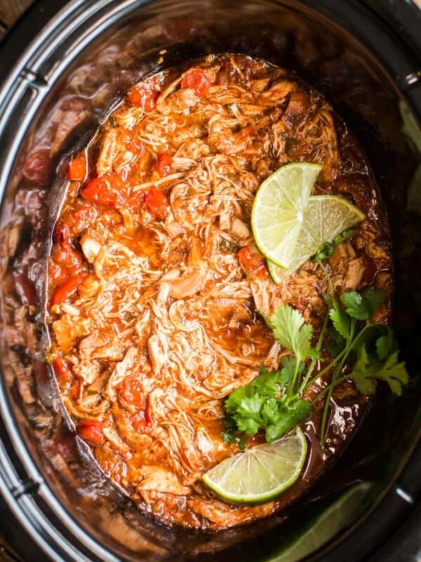 shredded salsa chicken in a slow cooker.