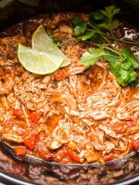homemade salsa chicken in slow cooker with limes