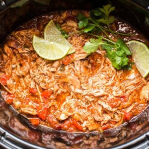 homemade salsa chicken in slow cooker with limes