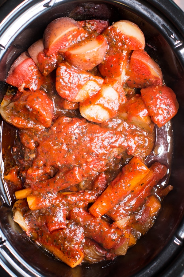 close up of Italain pot roast with tomato sauce on top.