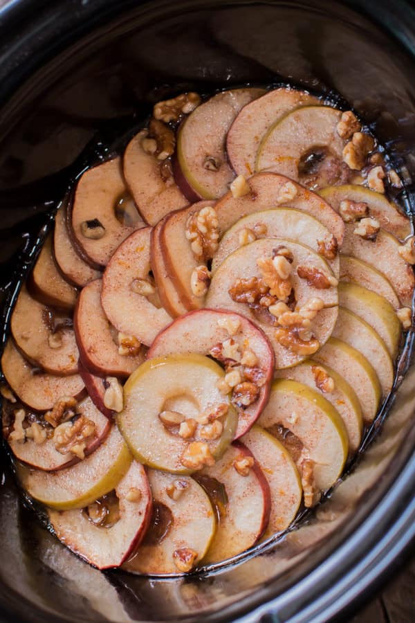 close up of scalloped apples in a slow cooker.