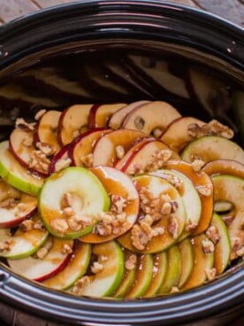sliced apples with glaze and walnuts on top.