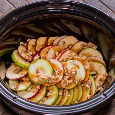 sliced apples with glaze and walnuts on top.