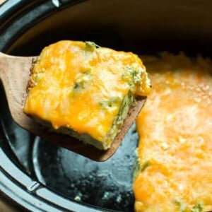 Piece of broccoli cheese quiche on a wooden spatula