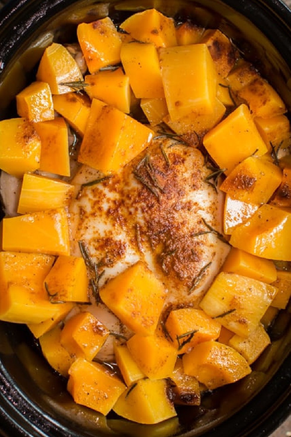 close up of butternut squash and a whole chicken.