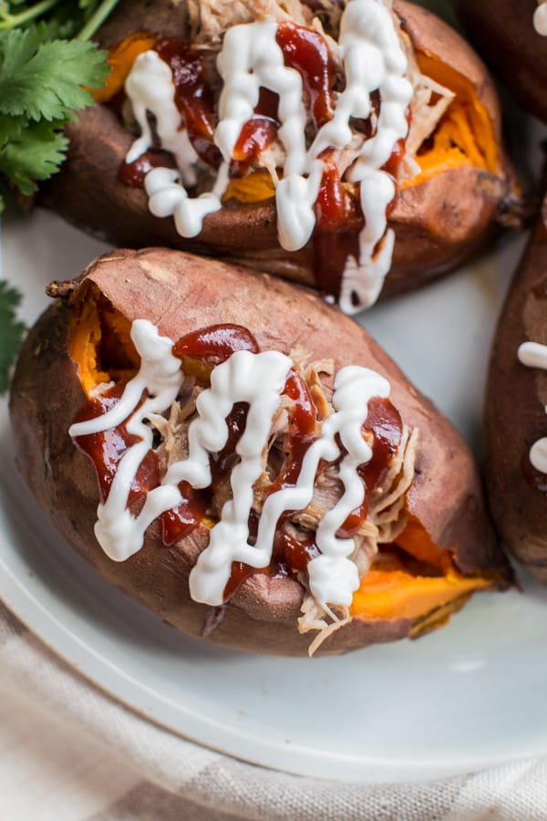 sweet potato stuffed with pulled pork with barbecue sauce and sour cream.