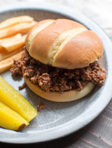 close up of barbecue beef sandwich on a pie tine.