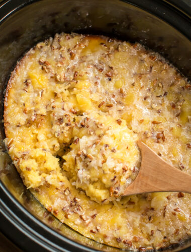 Pineapple spoon cake with glaze on top. Wooden spoon in it.