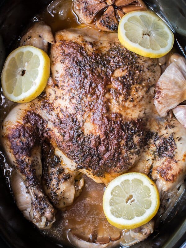 close up photo of engagement chicken in a slow ocoker with lemons