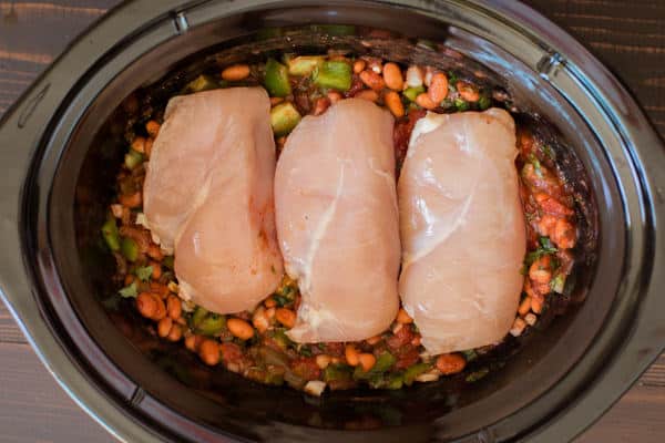 pinto beans, bell pepper with chicken breasts on top.
