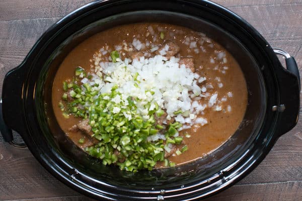 texas no bean chili in a slow cooker not yet cooked.