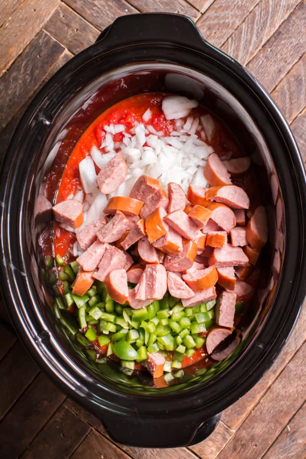 kielbasa, bell pepper, onion, and marinara sauce in a slow cooker.