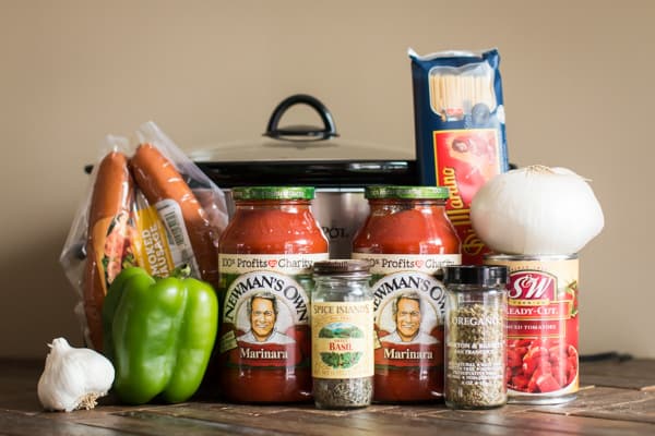 kielbasa, jars of marinara, seasonings, spaghetti, diced tomatoes, onion and bell pepper.