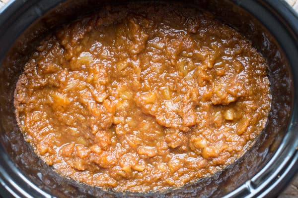 fully cooked pumpkin applesauce in a slow cooker cooling.