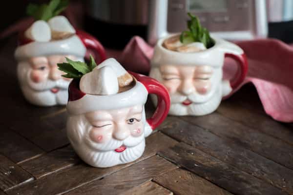 santa mugs with mint hot chocolate in them.