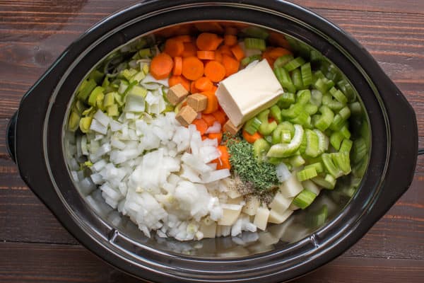 potaotes, onions, butter, celery, carrots, leeks, chicken bouillon in a slow cooker.