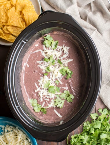 refried black beans in a slow cooker