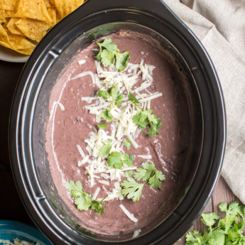 refried black beans in a slow cooker