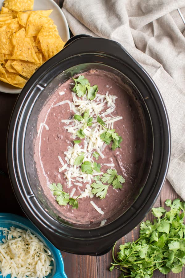 refried black beans in a slow cooker