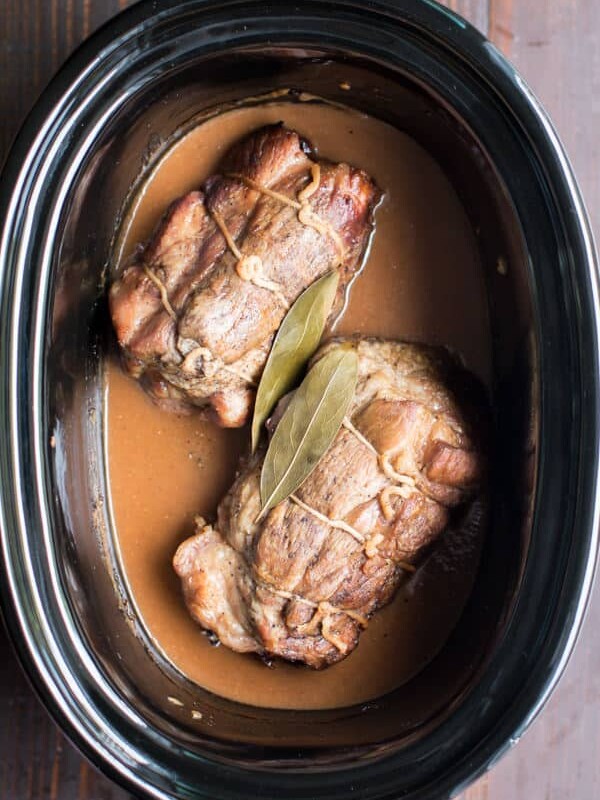 2 pork roasts in slow cooker in a cider gravy