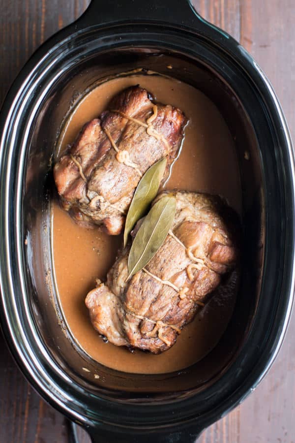 2 pork roasts in slow cooker in a cider gravy