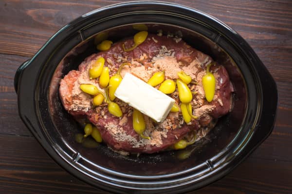 pot roast with spicy peppers on top and butter.