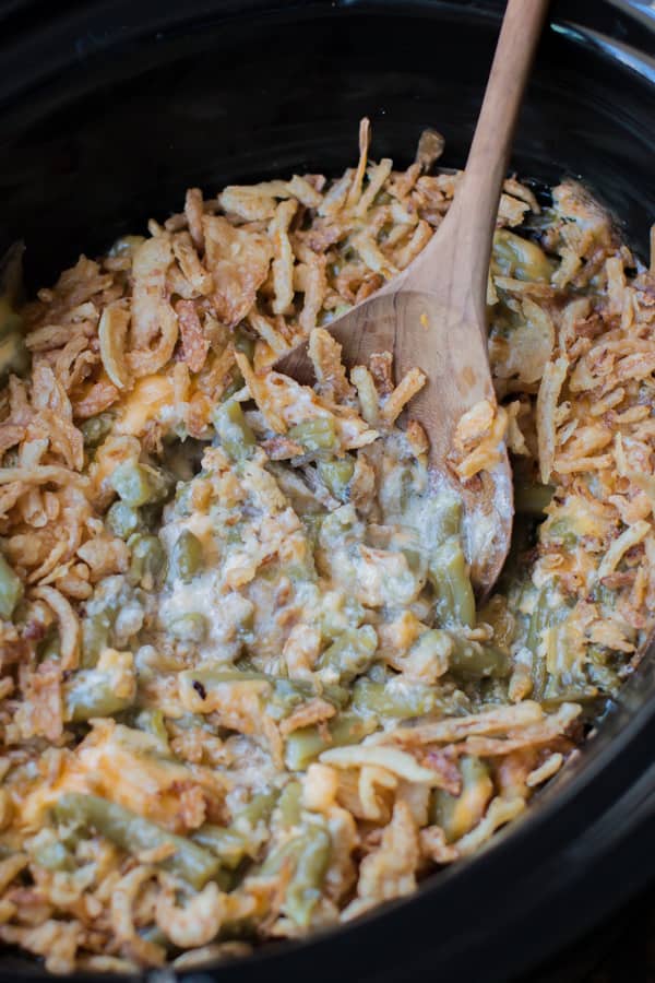 close up image of cheesy green bean casserole with French fried onions.