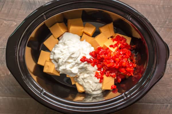 velveeta cubes, mayo, horseradish, pimentos in a slow cooker, not yet cooked or stirred.